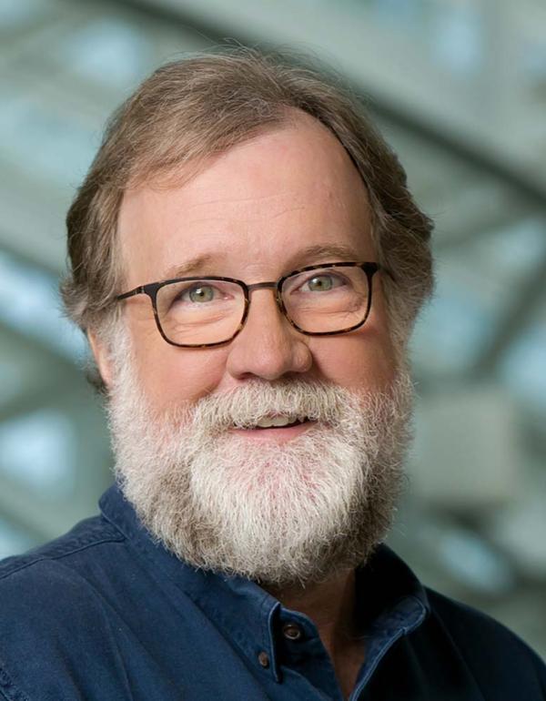 Evolutionary biologist Sean B. Carroll, bearded with glasses.