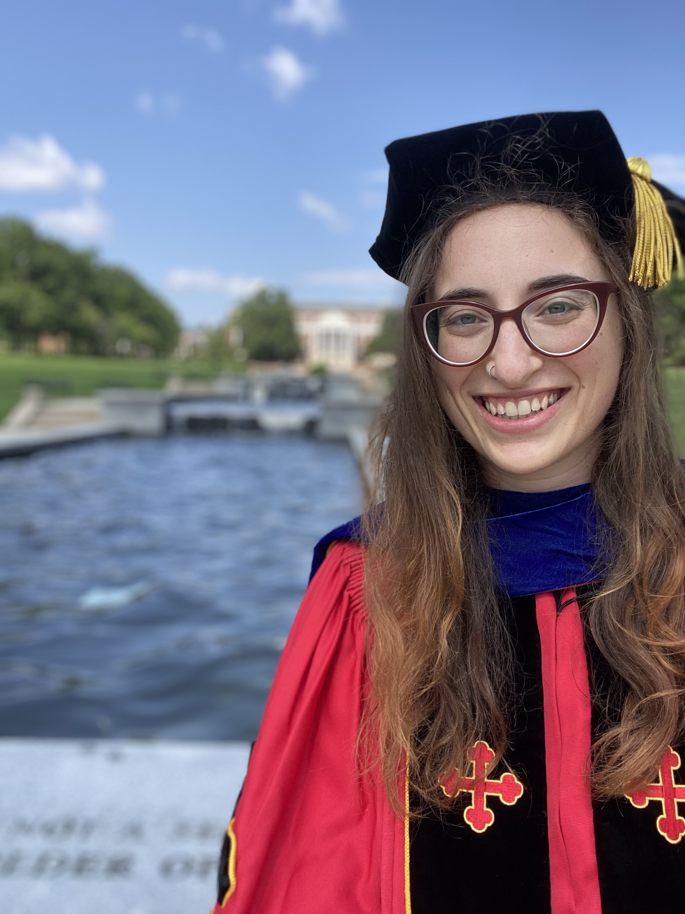 Jessica Kopew in UMD graduation cap and gown.