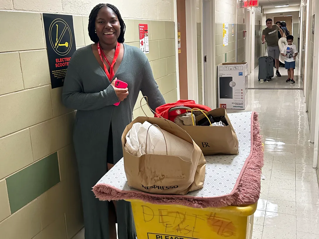Student moving into Easton Hall with big yellow cart
