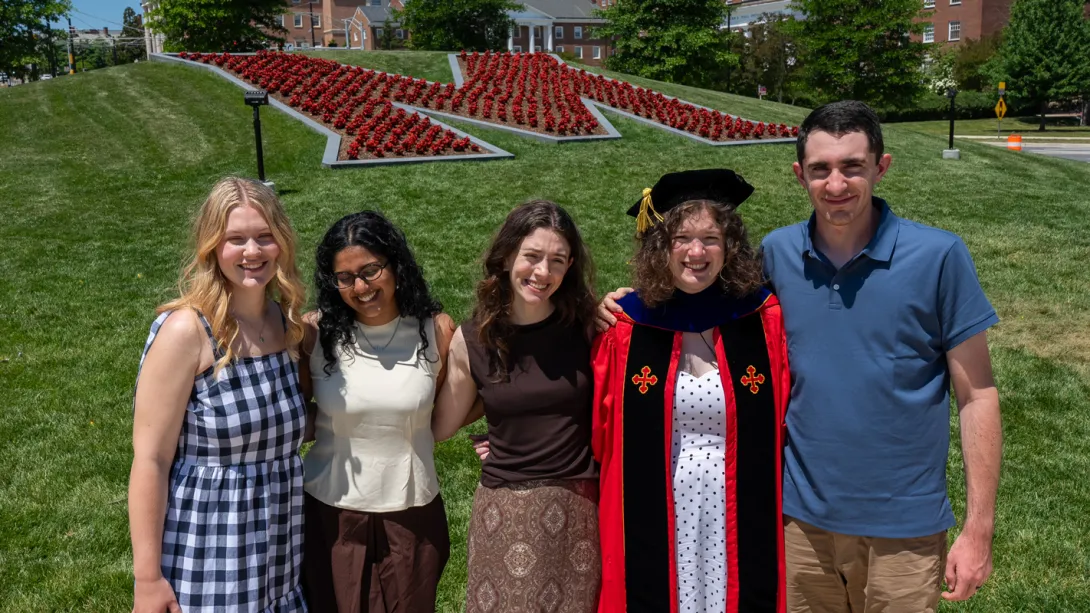 A Ph.D. graduate and her griends posing at the 